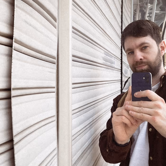 Artem Sapegin is making photos with a phone